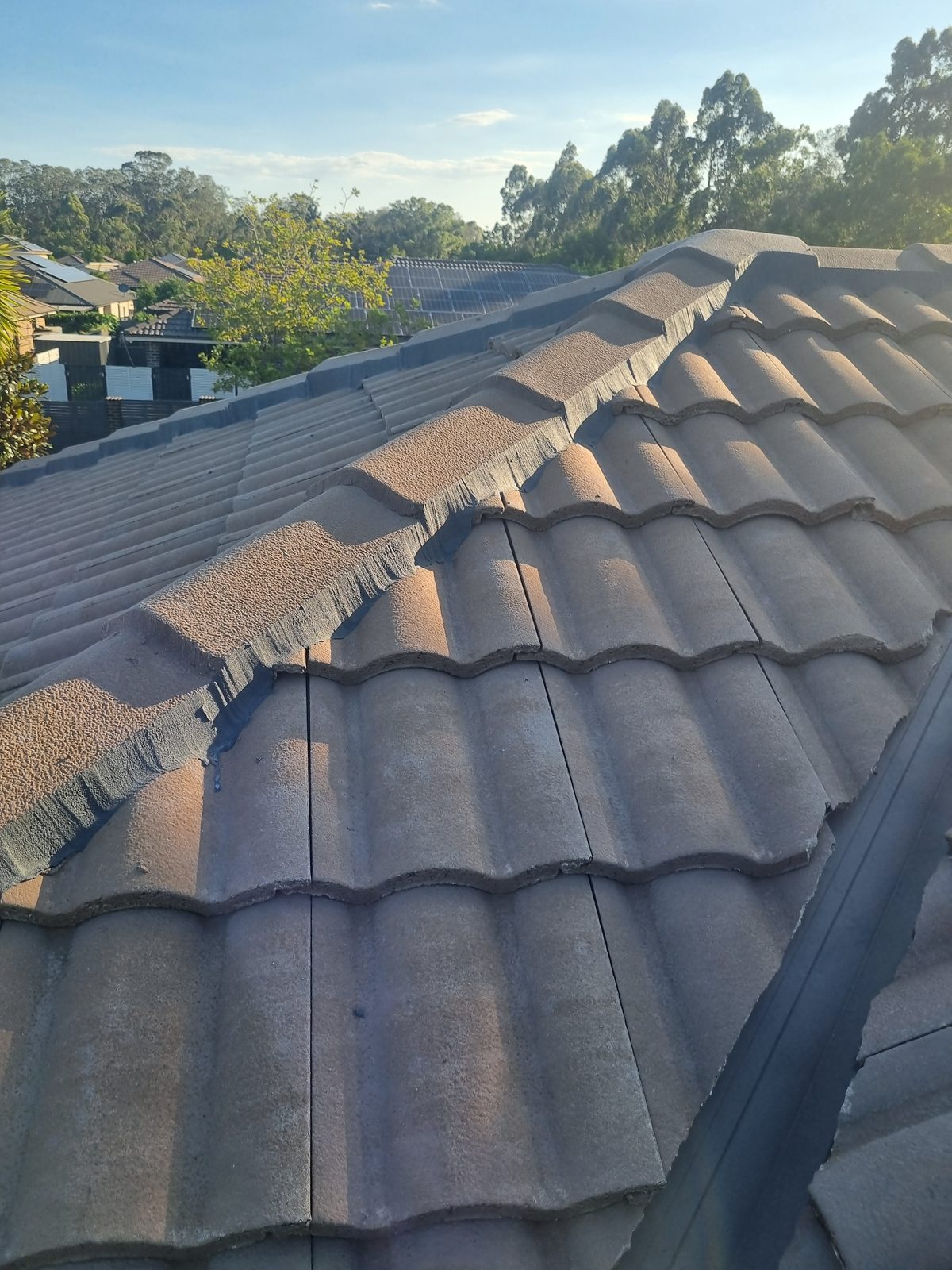 New flexible pointing applied along a concrete tile ridge line
